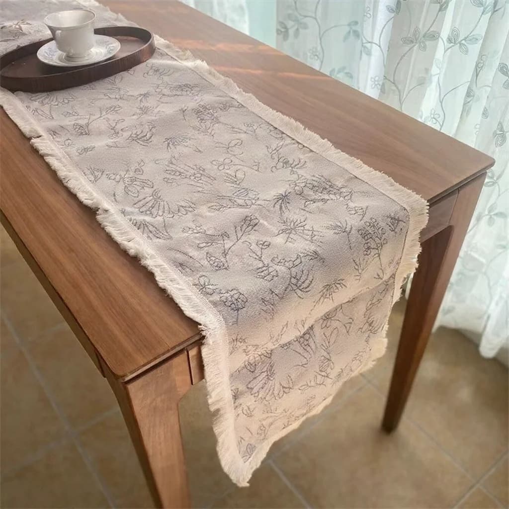 Camino de mesa estilo country americano en algodón y lino con estampado floral y borlas