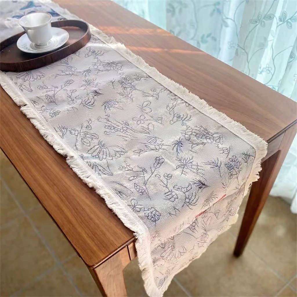 Camino de mesa estilo country americano en algodón y lino con estampado floral y borlas